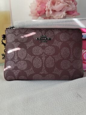Coach Signature Wristlet in Pearlized Deep Plum with Limited Edition Charm